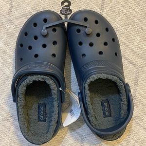 Navy lined crocs. Men’s size 9 or women’s size 11.